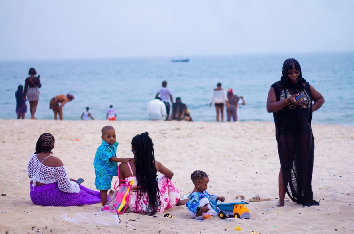 Wave Beach — families on the sand, swimmers beyond
